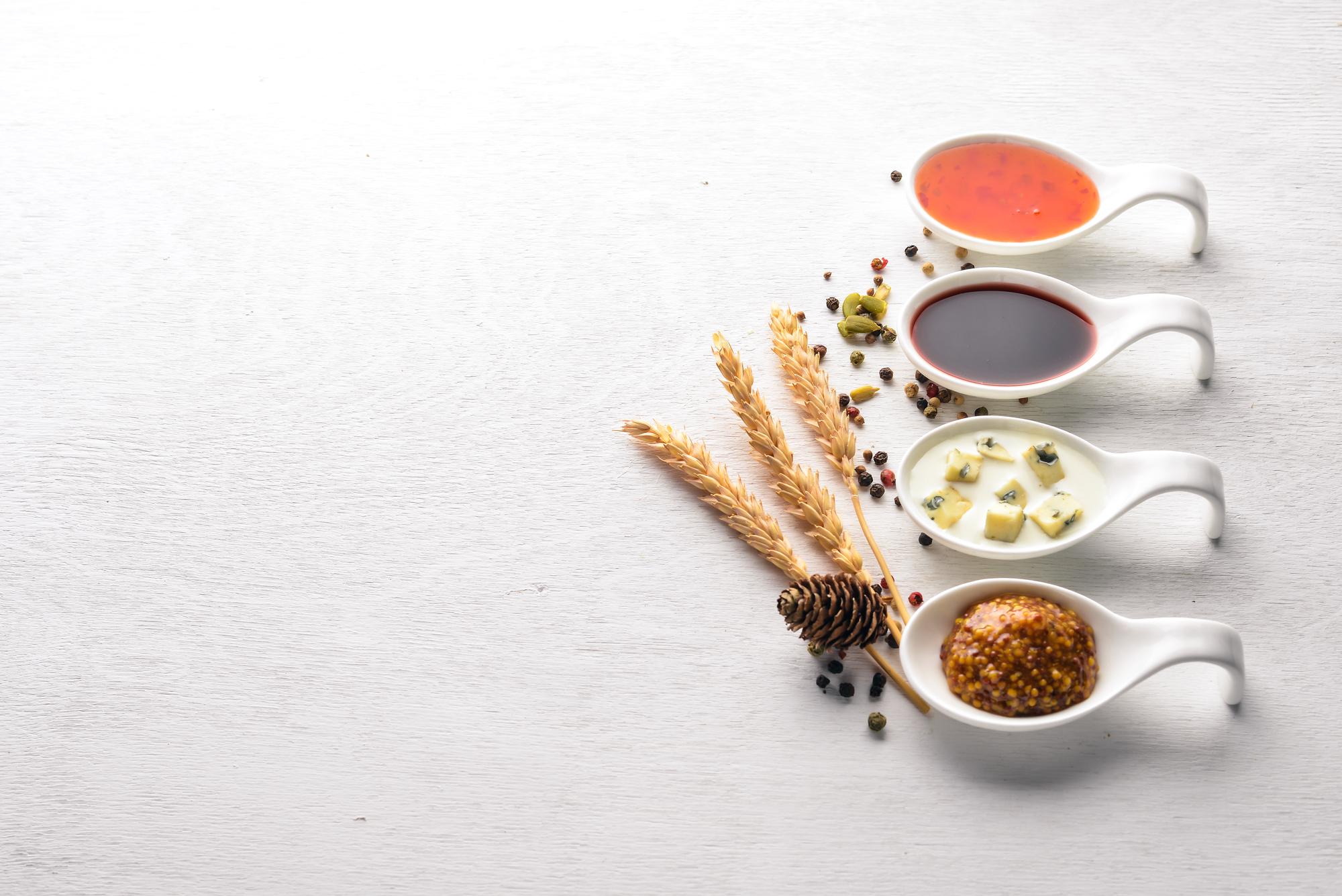 Small tasting setup with sauces and herbs