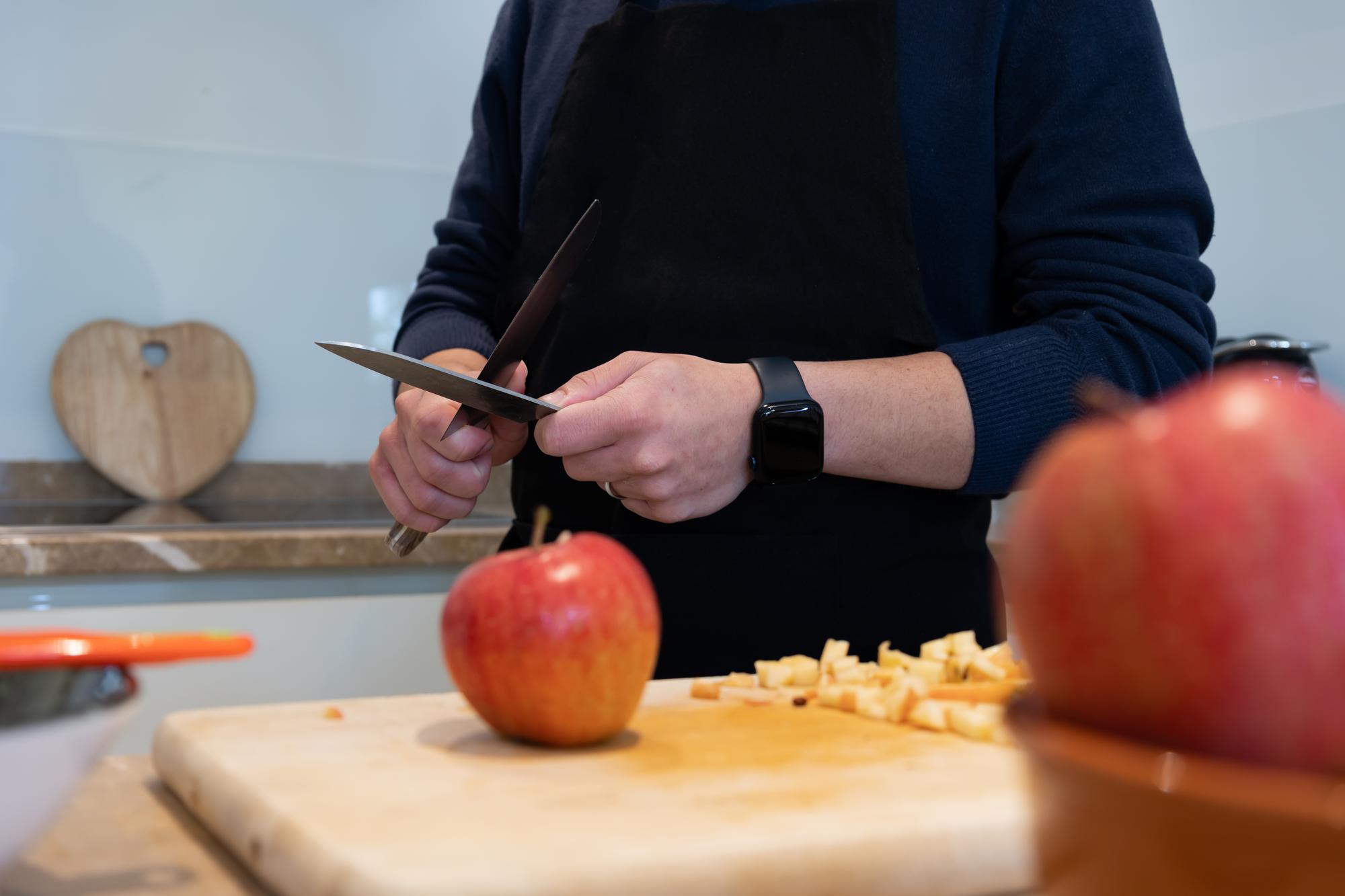 Instructor showing knife technique to student